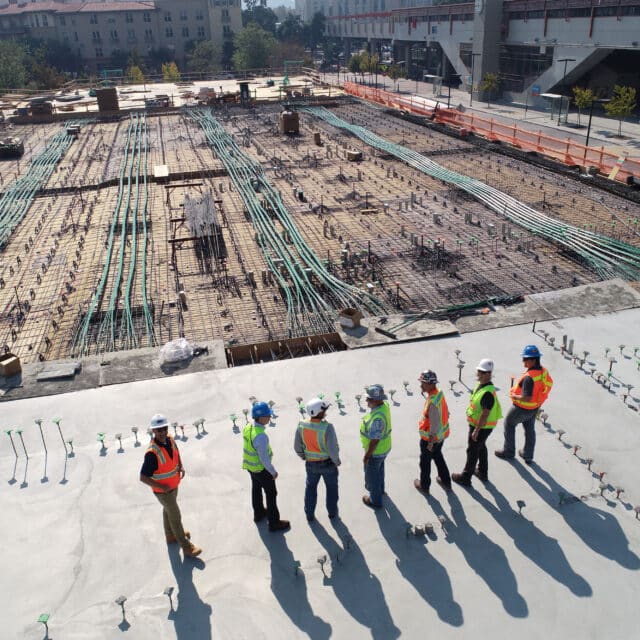 A group of Balfour Beatty construction workers standing on a construction site.