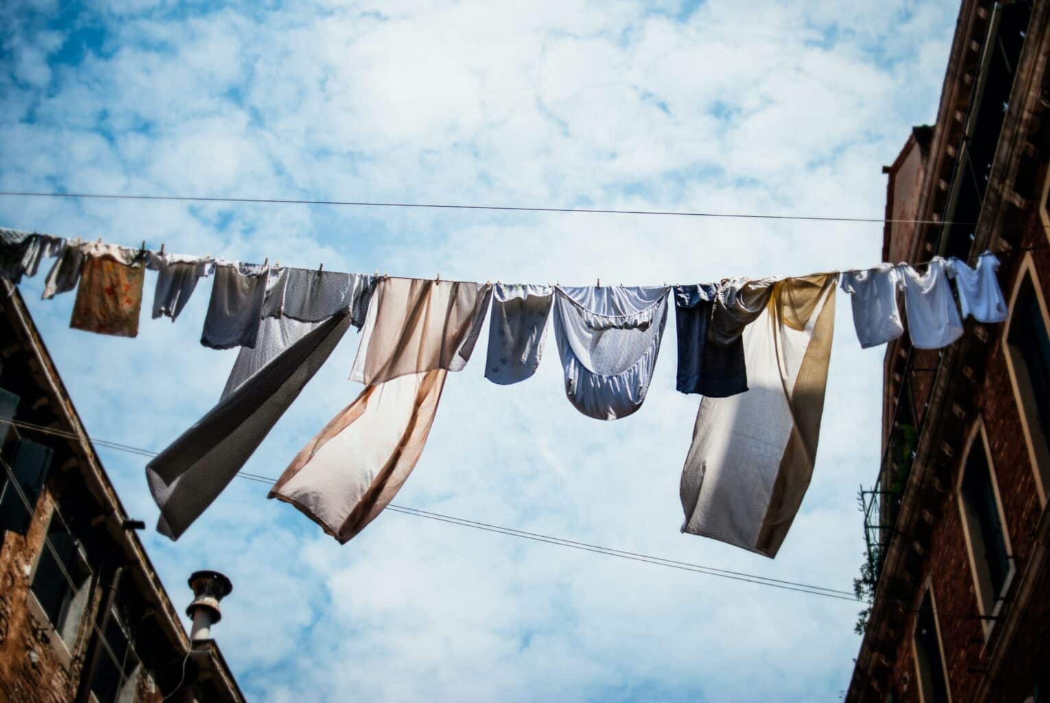 Clothes drying on a line in Venice, Italy, captured by a global traveler.