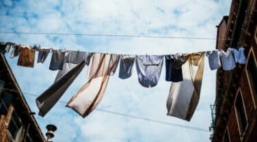 Clothes drying on a line in Venice, Italy, captured by a global traveler.