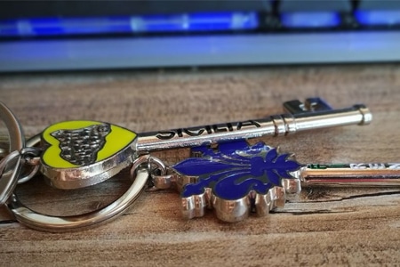 A keychain with a heart and flower, perfect for those seeking strategic and tech accessories.