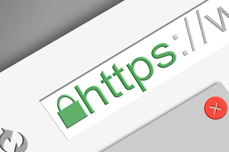 A global computer screen displaying the word 'https'.