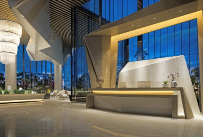 The lobby of a modern hotel at night.